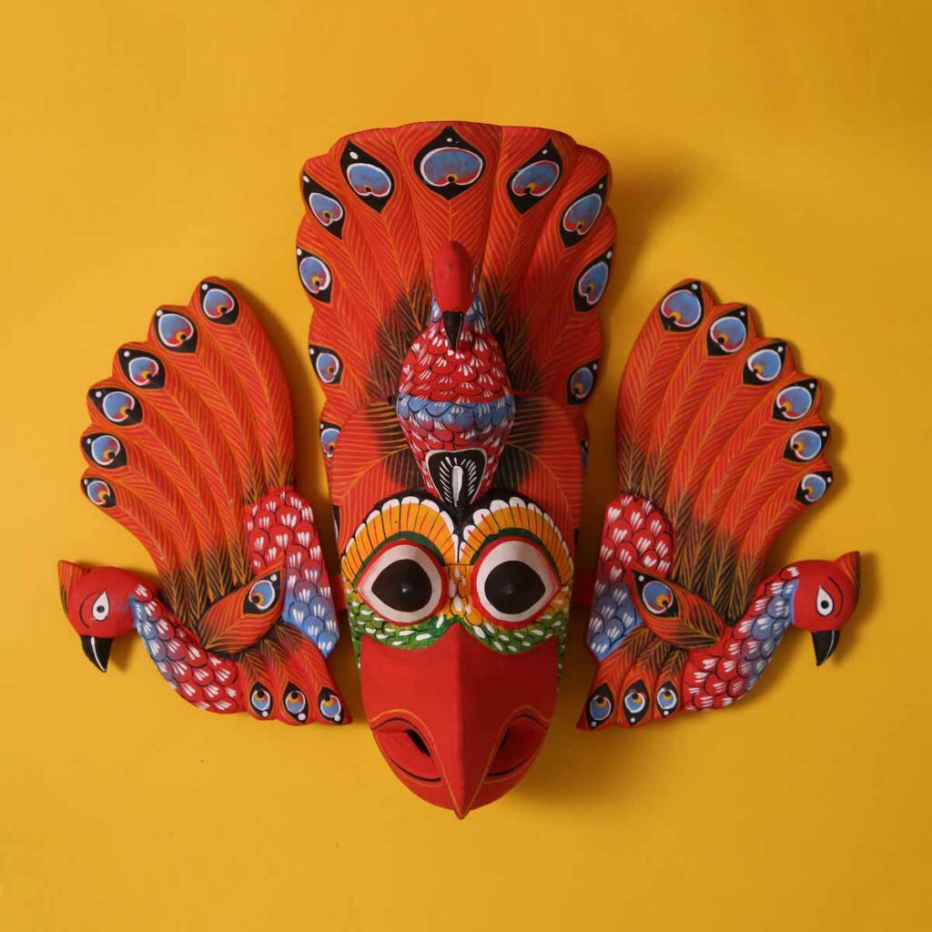 Orange Gurulu Raksha Mask | Who We Are